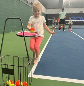 Mark coaching tennis