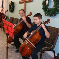 Grandson Craig playing cello with Uncle Tony